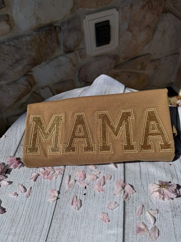 A brown bag with the word mama written on it.